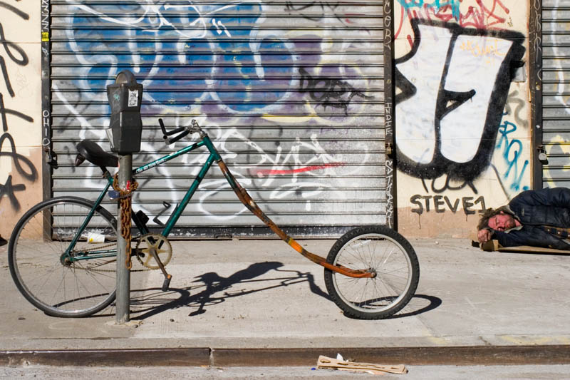 Empty Bike and Homeless Man