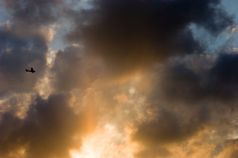 Plane and Clouds at Sunset